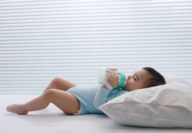 Baby, bottle with milk, bottle warmer